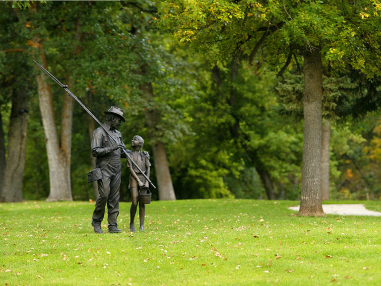 d c booth fish hatchery statues man girl 768x576