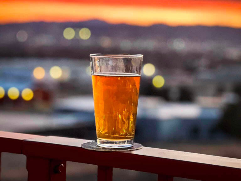valley taphouse beer on rail with sunset 768x576
